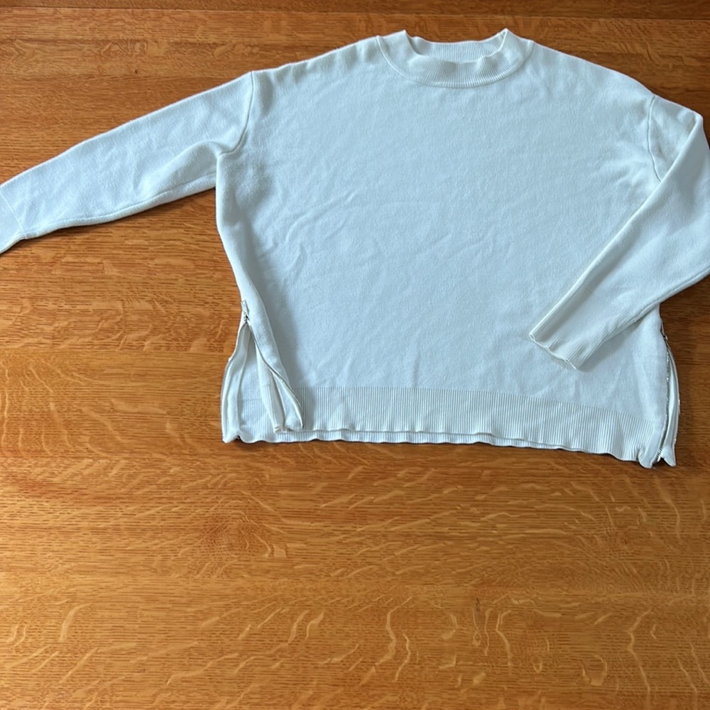 I am selling a white sweater from Philosophy Republic clothing. It is an XS.